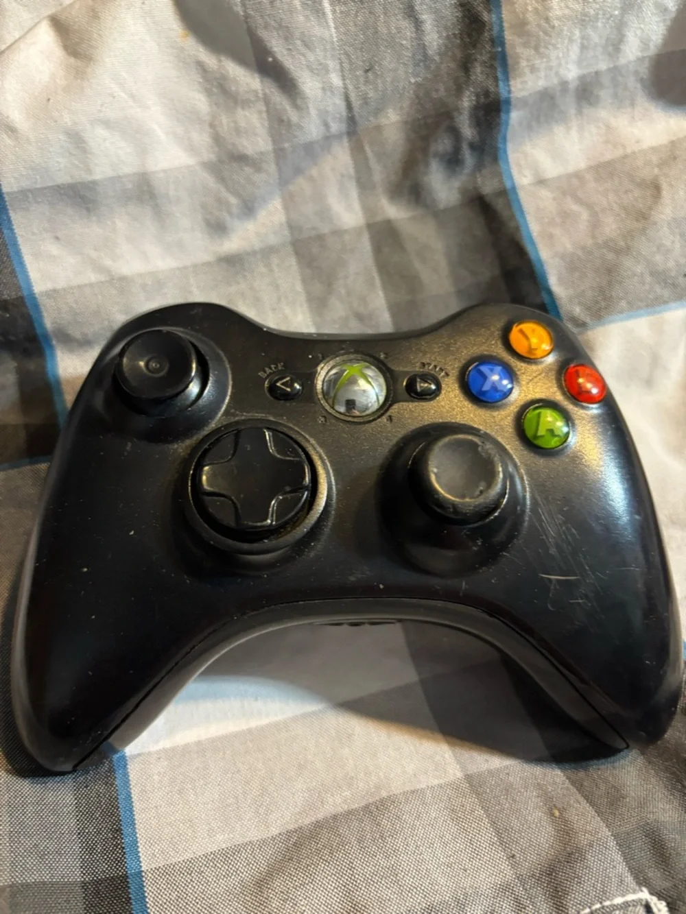 Microsoft Black Xbox 360 Wireless Controller with Colored Face Buttons.